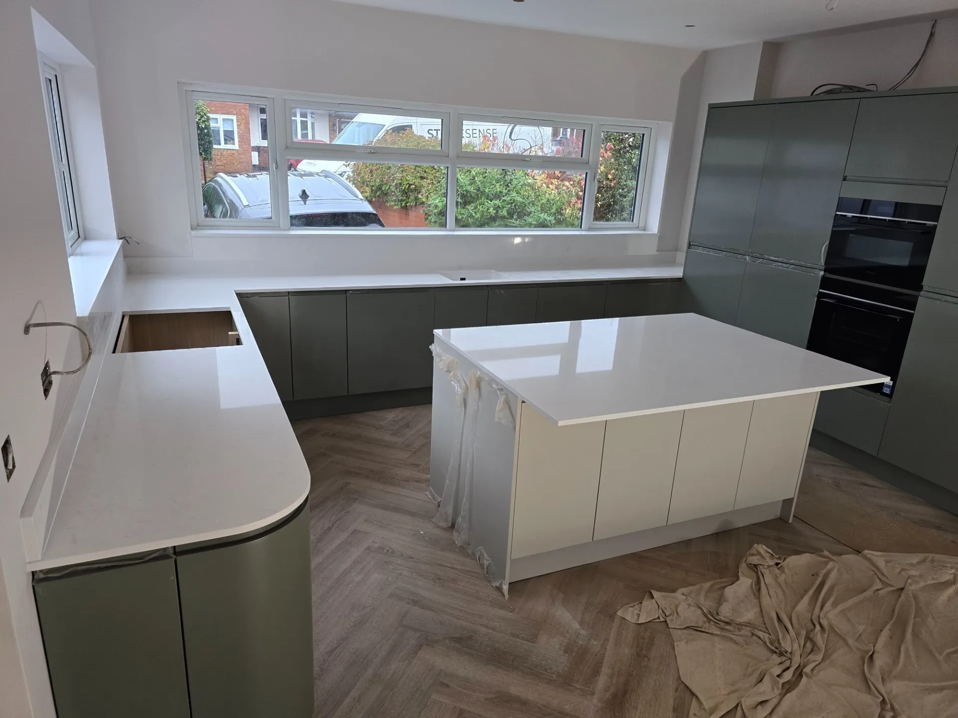 Industrial style kitchen with grey quartz countertops